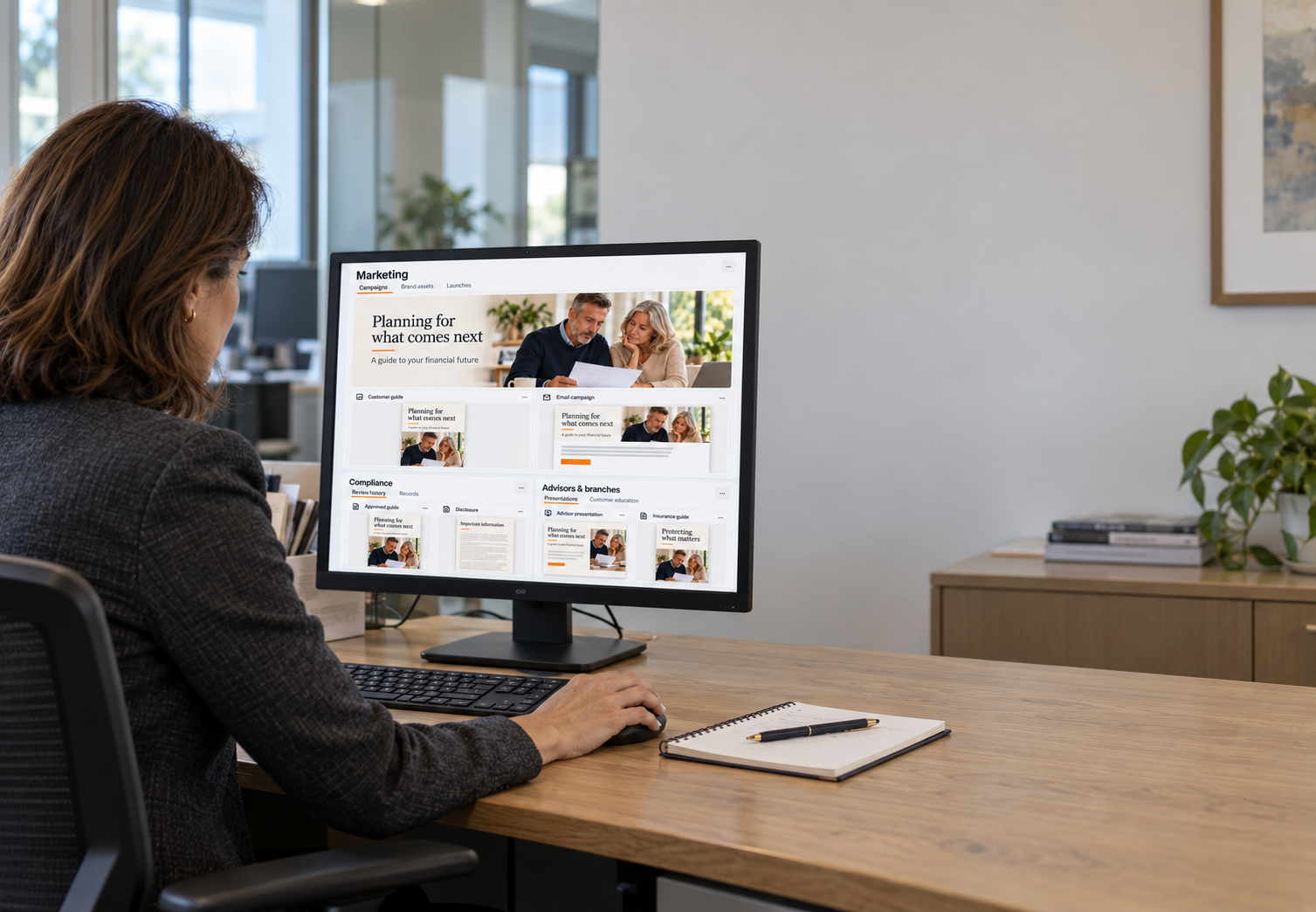 Woman reviewing approved financial content on a monitor
