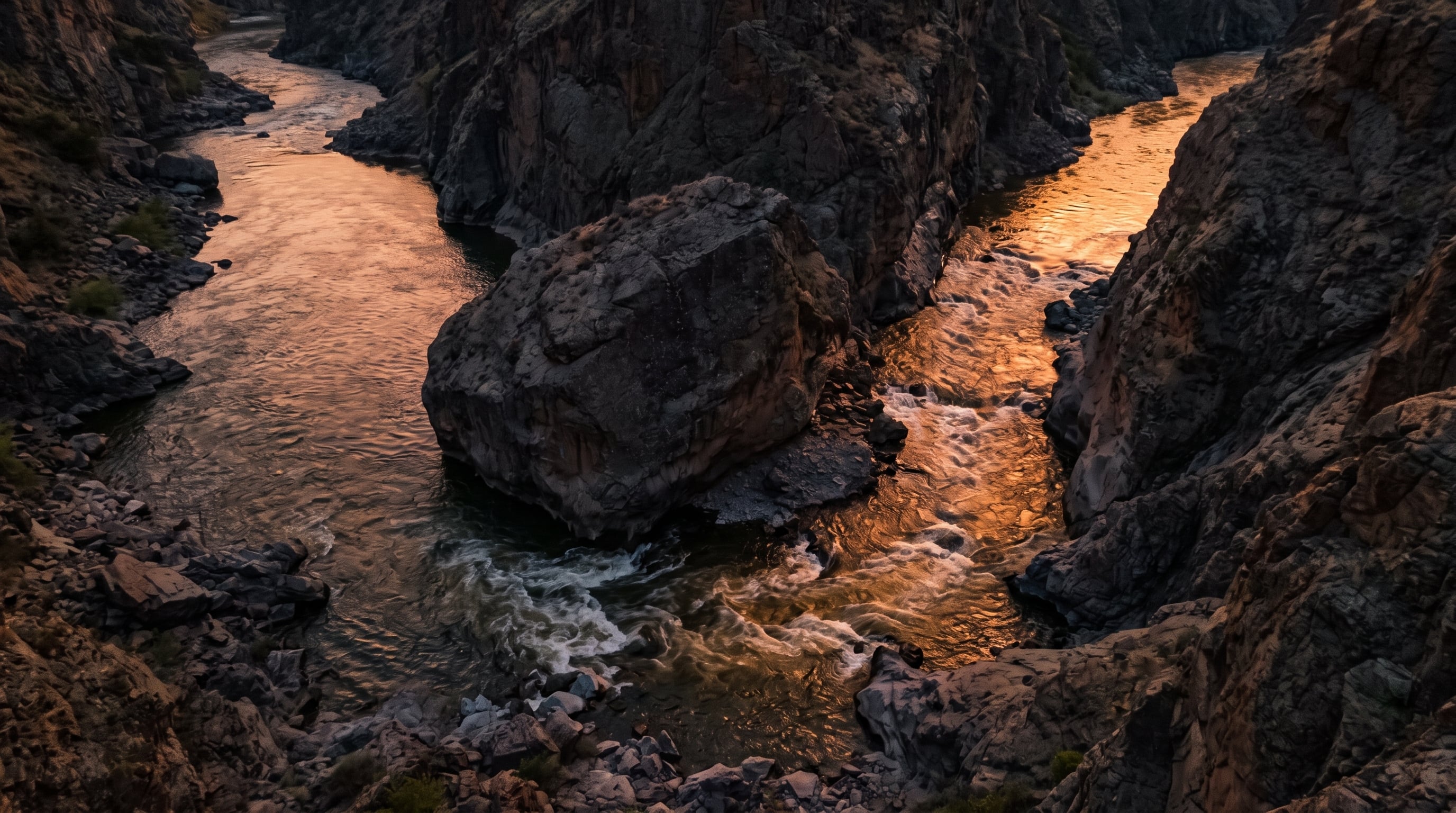 Orange Logic vs Aprimo: a river forced into a narrow detour channel around a large boulder, symbolizing the hidden costs and workarounds compromise creates in a DAM.
