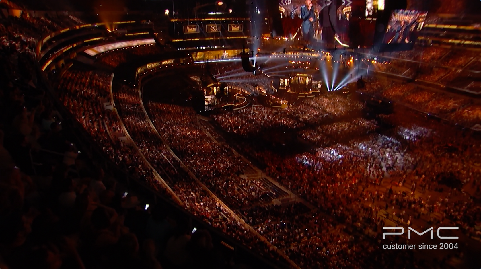 Overhead arena crowd and glowing stage